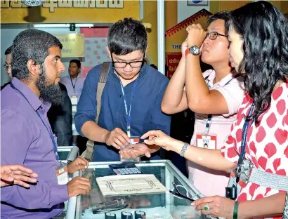  ??  ?? File picture of buyers at a Gem and Jewellery export fair in Colombo.