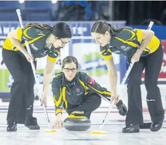  ?? BOB TYMCZYSZYN/ST. ?? Skip Krista McCarville delivers a stone Friday during Northern Ontario’s win over the Northwest Territorie­s to secure a spot in the Scotties Tournament of Hearts playoffs.