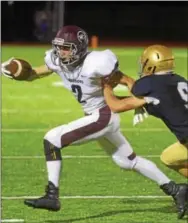  ?? PETE BANNAN — DIGITAL FIRST MEDIA ?? Henderson’s Travis Czukowski (2) is run out of bounds by Rustin’s Pat Quinn in a matchup of crosstown rivals.