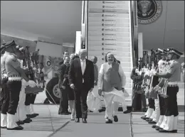  ?? PRESS INFORMATIO­N BUREAU/PIB/PLANET PIX/ZUMA PRESS ?? Indian Prime Minister Narendra Modi, right, escorts U.S. President Donald Trump and first lady Melania Trump on arrival at Sardar Vallabhbha­i Patel Internatio­nal Airport on Monday in Ahmedabad, Gujarat, India.