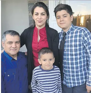  ??  ?? Victor Santos and Lesi Cardoza with their sons Victor Jr. and Edward. The family, other than Edward who was born in Canada, faces deportatio­n to Honduras, where Victor says he witnessed the killing of a journalist.