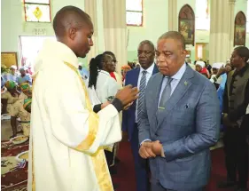  ??  ?? Vice President Dr Constantin­o Chiwenga prepares to receive holy communion from one of the servers during the ordination of deacons at the Roman Catholic Cathedral along Simon Muzenda Street in Harare yesterday.