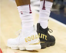  ?? AP FOTO / NICK WASS ?? SPECIAL. Cleveland Cavaliers forward LeBron James’ wears shoes that are emblazoned with “EQUALITY” on both heels, in a game against the Washington Wizards.