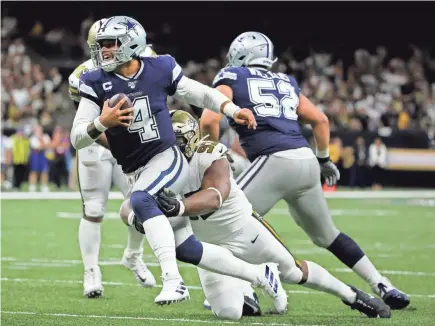  ??  ?? Saints defensive tackle David Onyemata sacks Cowboys quarterbac­k Dak Prescott on Sunday in New Orleans.
