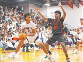  ?? Erik Verduzco Las Vegas Review-journal ?? Liberty’s Dedan Thomas Jr. looks for an opening under defensive pressure from Coronado’s Josiah Cunningham. Thomas had a game-high 23 points for the Patriots in the semifinal win.