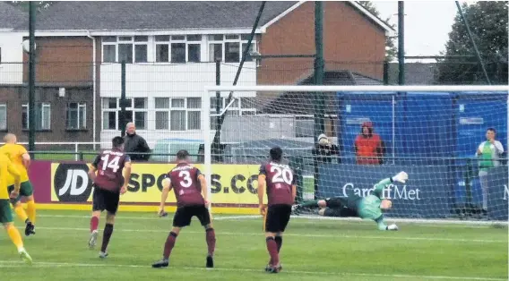  ??  ?? Nathan Craig converts from the spot for Caernarfon