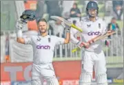  ?? AFP ?? Ben Duckett celebrates his century with Zak Crawley during the first day of the first Test against Pakistan in Rawalpindi.