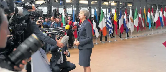  ?? Photo / AP ?? Theresa May said both sides need to show “courage, trust and leadership”.