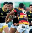  ??  ?? Julian Savea is tackled yesterday.