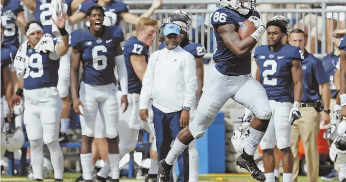  ?? AP FILE PHOTO ?? TOP 10 CLASH: Daniel George (86) and his Nittany Lions mates hope to enjoy another Happy Valley party when Ohio State comes to Penn State tonight.