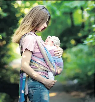  ??  ?? Baby carriers have been found to significan­tly reduce crying and improve the bond between parent and infant. Below are the BabyBjorn Baby Carrier One (babybjorn.com), left, and Ergobaby’s Original carrier.