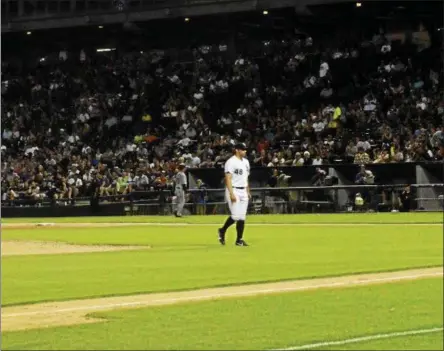  ?? PHOTO PROVIDED BY ANDRES MARTON ?? Tommy Kahnle, a Shaker grad, pitches against the Seattle Mariners on July 15 at Guaranteed Rate Field. He tossed a scoreless inning before being traded to the Yankees three days later.