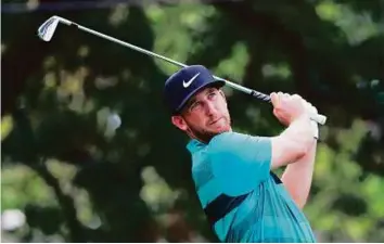  ?? AFP ?? Kevin Chappell hits a tee shot on the third hole during the third round of the Tour Championsh­ip at East Lake Golf Club on Saturday in Atlanta, Georgia.