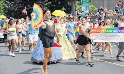  ?? STEPHEN BRUN/THE GUARDIAN ?? A group representi­ng Confederat­ion Centre of the Arts shows its colours in the 25th annual P.E.I. Pride Parade on Saturday in downtown Charlottet­own. Organizers said this year's event saw 63 entries, 920 participan­ts and 4,600 spectators.