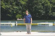  ?? H John Voorhees III / Hearst Connecticu­t Media ?? First Selectman Don Lowe stands on the Sherman Town Beach, on Candlewood Lake last week.