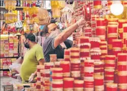  ?? AP ?? A trader arranges bangles at his shop in Jammu as markets reopen after Lockdown 4.0 relaxation­s kick in on Wednesday.