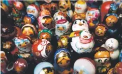  ??  ?? Russian/Ukrainian souvenirs, wooden carved dolls and Santas were among the items for sale at a recent Denver Christkind­l Market.