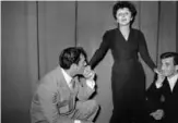  ??  ?? In this file photo taken on January 1, 1950 French singer Edith Piaf (center) poses with American actor Eddie Constantin­e (left) and French singer Charles Aznavour in Paris.