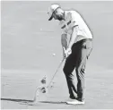  ??  ?? Chris Kirk hits a shot from the ninth fairway in the third round of The Players Championsh­ip on Saturday. Kirk shot 68 and leads by a stroke heading into today’s final round.