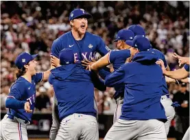  ?? Brynn Anderson/associated Press ?? Texas Rangers players celebrate after winning Game 5 of the World Series on Wednesday, locking up the first championsh­ip in the franchise’s 63-year history.