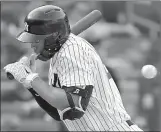  ?? Associated Press photo ?? New York Yankees designated hitter Giancarlo Stanton reacts as a pitch from Toronto Blue Jays relief pitcher Luis Santos is about to hit him during the eighth inning of a baseball game, Saturday in New York. The Yankees won 11-6.