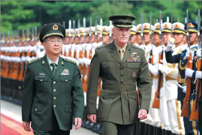  ?? WANG ZHUANGFEI / CHINA DAILY ?? General Fang Fenghui, chief of the People’s Liberation Army’s Joint Staff Department, holds a welcoming ceremony for his US counterpar­t, Marine Corps General Joseph Dunford, chairman of the US Joint Chiefs of Staff, in Beijing on Tuesday.