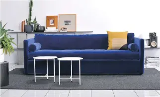  ??  ?? Atrium, a deep blue velvet couch, features simple lines, soft cushions, and a rich, vibrant colour.