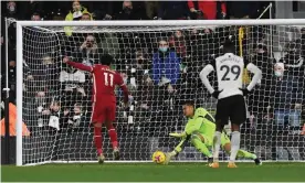  ??  ?? Mohamed Salah fires past the Fulham goalkeeper, Alphonse Areola, to score Liverpool’s equaliser. Photograph: Neil Hall/Reuters