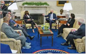  ?? (AP/Patrick Semansky) ?? President Joe Biden and Vice President Kamala Harris meet with lawmakers Monday in the Oval Office of the White House to discuss the $2.3 trillion infrastruc­ture proposal.