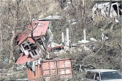  ??  ?? This September 23 photo shows some of the devastatio­n wreaked by Hurricane Maria in Roseau, the capital of Dominica.