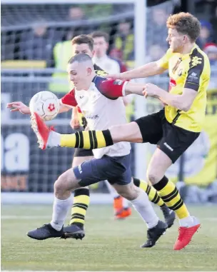  ?? Www.mphotograp­hic.co.uk ?? ●●Frank Mulhern gives the Harrogate Town defence the runaround during Saturday’s FA Trophy clash