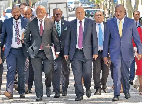  ?? Picture: GCIS ?? FIRM HAND ON FINANCES: Minister Pravin Gordhan, flanked by his Deputy Mcebisi Jonas and Director-General Lungile Fuzile, ahead of the Budget speech. Gordhan delivered his Budget in the National Assembly yesterday.