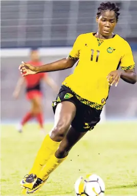  ?? GLADSTONE TAYLOR ?? Jamaican striker Khadija Shaw goes on the move during Jamaica’s 9-0 win over Antigua and Barbuda in the CONCACAF Caribbean Womens Qualifier match at the National Stadium last Saturday. Shaw scored three of Jamaica’s goals.