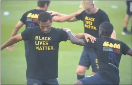  ?? MEDIANEWS GROUP FILE PHOTO ?? Wearing Black Lives Matter shirts designed by the Union’s Warren Creavalle, members of the Union like Andrew Wooten, left, and Jamiro Monteiro, right, have been vocal in the protests against police brutality and systemic racism. The Union and D.C. United will play Saturday night.