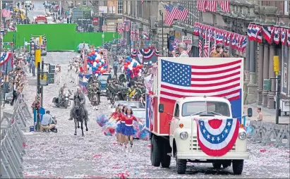  ??  ?? A parade scene for the fifth Indiana Jones movie is filmed in St Vincent Street, Glasgow, last month