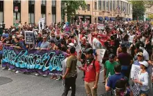  ?? Daniel Slim / AFP / Getty Images ?? Hundreds of counterpro­testers march against the white nationalis­ts’ Unite the Right rally Sunday in Washington, D.C.