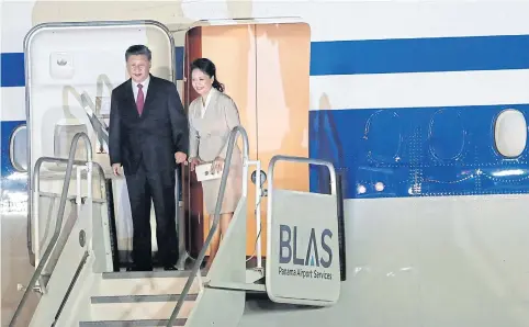  ?? REUTERS ?? President Xi Jinping and his wife Peng Liyuan arrive for their first state visit to Panama on Sunday, which is followed by a two-day visit to Lisbon.