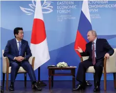  ?? — Reuters photo ?? Putin and Abe attend a meeting on the sidelines of the Eastern Economic Forum in Vladivosto­k, Russia.