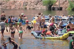  ??  ?? Salt River Tubing implemente­d some guidelines to promote safety during the pandemic, but the river was still plenty busy on Saturday.