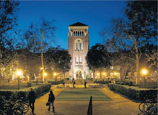  ?? Marcus Yam Los Angeles Times ?? THE USC campus at dusk. Composed of 57 voting members, the school’s board of trustees includes philanthro­pists, alumni, Hollywood insiders and industrial tycoons.