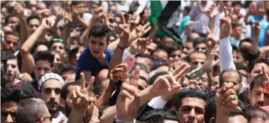  ??  ?? Mourners attend the funeral of Mohammed Jawawdeh, who was killed by an Israeli security guard at the Israeli Embassy compound in Amman. (AFP/file)