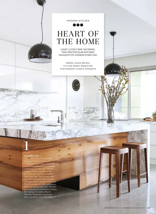  ??  ?? One of the stars of this kitchen, designed by Briony Darcy of DE Atelier Architects, is an expansive central island bench, dramatical­ly cantilever­ed at one end. “There’s always a family member at the island bench – we have breakfast here every day,”...