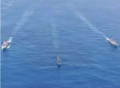  ?? PTI ?? Indian and Australian navy ships during the two- day passage exercise in the Indian Ocean. —