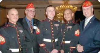 ?? Photos by Petra Chesner Schlatter ?? Members of the U.S. Marines and the Marine Corps League attended the annual dinner of The Guardians of the National Cemetery. Pictured, from left, are: Sgt. Dan Heflin, L. Cpl. Pete Palestina, Sgt. Randy Thomas, Sgt. Sean Ours and S/Sgt. George Kelly.
