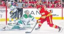  ?? REUTERS ?? Dallas Stars goaltender Jake Oettinger makes a save against Calgary Flames left-wing Andrew Mangiapane during the second period in Game 2 of the first round of the 2022 Stanley Cup playoffs at Scotiabank Saddledome on Thursday.