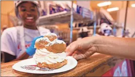  ?? Photo Provided by Wisconsin State Fair. ?? No visit is complete without a signature Wisconsin Cream Puff.