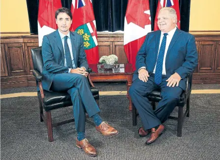  ?? RENÉ JOHNSTON/ TORONTO STAR ?? Prime Minister Justin Trudeau and Premier Doug Ford were at odds Thursday over asylum seekers, with a Ford spokespers­on blasting Ottawa for creating a “mess” by encouragin­g “illegal bordercros­sers to come into our country.”