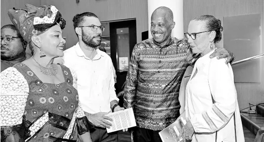  ?? CONTRIBUTE­D PHOTOS ?? Lady Mary Beckles (left) with her husband, Professor Sir Hilary Beckles (third from left), Vice Chancellor of The University of the West Indies, with relatives, attorney-at-law Luke and his mom, Sandra Minott Phillips, at the Festschrif­t launch of “‘Interrogat­ing Justices’ at the UWI Mona on February 15.