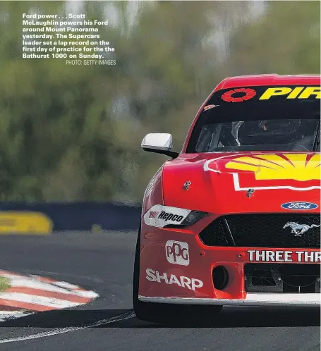  ?? PHOTO: GETTY IMAGES ?? Ford power . . . Scott McLaughlin powers his Ford around Mount Panorama yesterday. The Supercars leader set a lap record on the first day of practice for the the Bathurst 1000 on Sunday.