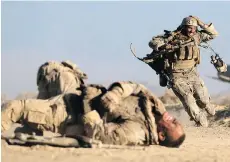  ?? AMAZON STUDIOS ?? WWE wrestler John Cena, foreground, and Aaron Taylor-Johnson star in the Iraq war film The Wall.